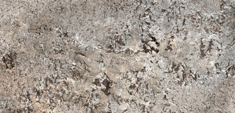 Glacial Blue to naturalny granit z Indii o chłodnym, niebiesko-szarym tle z delikatnymi białymi i srebrzystymi zamgleniami..