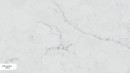 Avant Quartz Aquitaine Blanca to konglomerat kwarcowy w jasnoszarym odcieniu z delikatnym atramentowym użyleniem