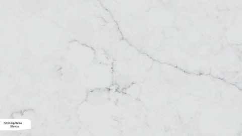 Avant Quartz Aquitaine Blanca to konglomerat kwarcowy w jasnoszarym odcieniu z delikatnym atramentowym użyleniem