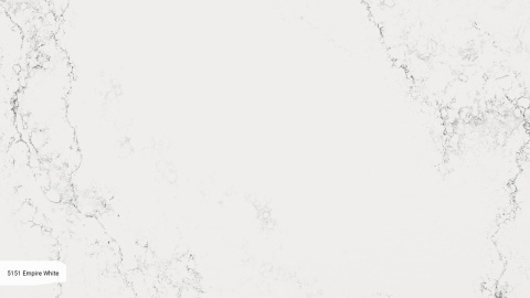 Caesarstone Empira White to luksusowy konglomerat kwarcowy o czystej, białej bazie przełamanej subtelnymi, rozmytymi żyłkami.