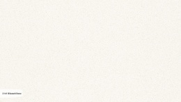 Caesarstone Blizzard/Snow to jednolita, śnieżnobiała płyta konglomeratu kwarcowego o połysku i subtelnych szarych drobinkach.