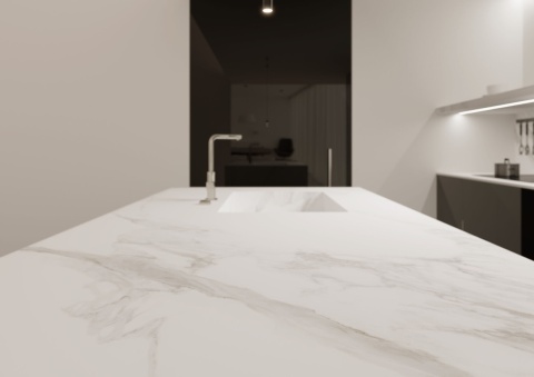 Blat pokryty płytą wykonaną ze spieku  Calacatta Extra White o Śnieżnobiaym tle kontrastującym z  subtelnym szarym użyleniem