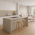 Nowoczesna kuchnia otwarta na salon z wyspą wykończoną spiekiem Infinity Arkeon Fossil Matte w białym świetle.