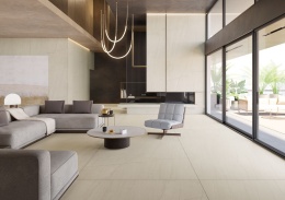 Przestronny salon z płytami Infinity MB28 White Macaubas na podłodze i ścianach