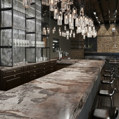 Nowoczesny blat barowy z Dekton Trilium w matowym wykończeniu, inspirowany surową stalą.