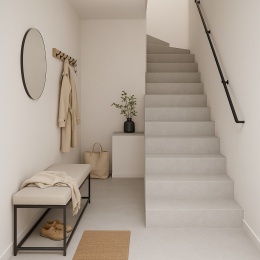 Nowoczesny przedpokój z jasnoszarymi schodami wykończonymi spiekiem Infinity Arkeon Sandstone Light Matte i domowymi dodatkami.