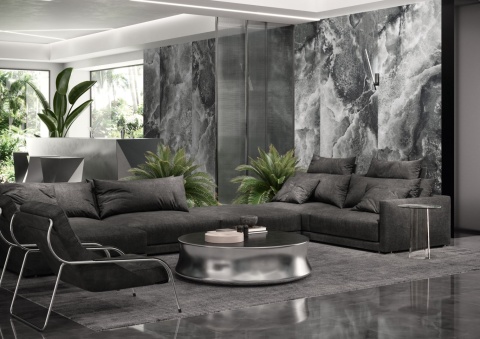 Salon z dużymi płytami Laminam Lamborghini Tempestas na ścianach w grafitowo–szarej kolorystyce