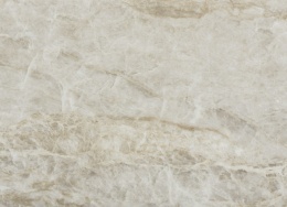 Zbliżenie płyty Dekton Taga – struktura powierzchni Dekton Taga w beżowo-szarej kolorystyce z subtelnym złotym żyłkowaniem.