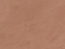 Zbliżenie na powierzchnię Dekton Umber w matowym wykończeniu, w ciepłym terakotowym kolorze.