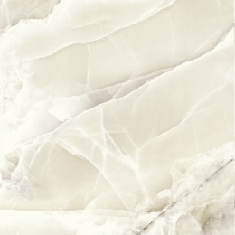 Ciepły spiek kwarcowy Grespania Alaska Ambar Pulido – kremowy onyks z połyskiem i efektem głębi.