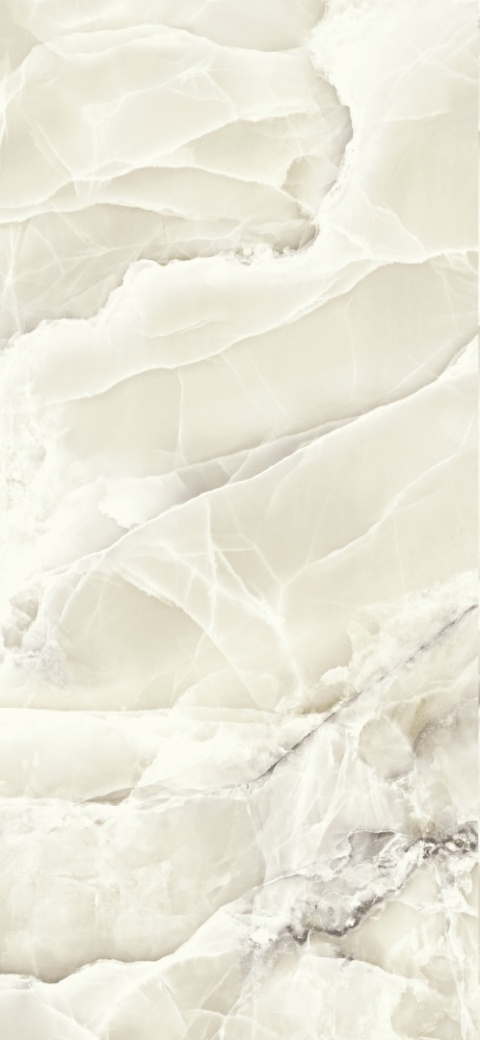 Ciepły spiek kwarcowy Grespania Alaska Ambar Pulido – kremowy onyks z połyskiem i efektem głębi.