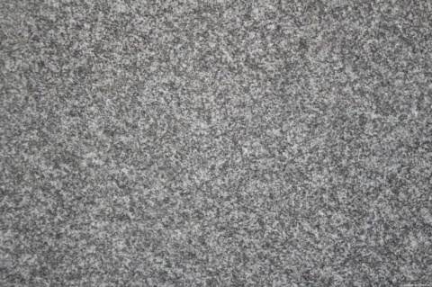 zbliżenie powierzchni, ukazujące drobnoziarnistą strukturę kamienia oraz naturalne niuanse kolorystyczne.