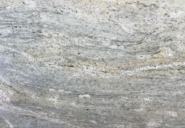 zbliżenie struktury kamienia, pokazujące naturalne przejścia kolorów, drobne żyłki i połysk powierzchni.