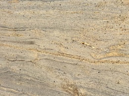 zbliżenie powierzchni kamienia, ukazujące delikatne żyłkowanie oraz naturalne przejścia odcieni.