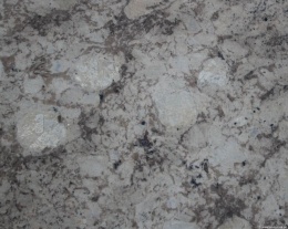 Pierwsze zdjęcie – płyta Mona Lisa w wykończeniu naturalnym, pokazująca matową powierzchnię z widoczną strukturą kamienia