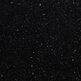 Zbliżenie granitu Star Galaxy o czarnej powierzchni z licznymi złotymi drobinkami