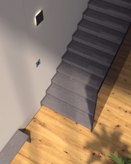 Nowoczesne schody z aglomarmuru Baltic Grey w eleganckim wnętrzu z drewnianą podłogą i oświetleniem LED
