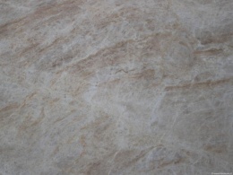 Tekstura kwarcytu Taj Mahal w wykończeniu szczotkowanym z delikatnymi beżowo-złotymi żyłami.