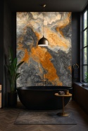 Czarna wanna na tle płyty onyksu z pomarańczowo-szarymi żyłkami, złote akcenty i rośliny.