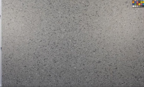 Granit Steel Grey płomień – próbka płyty z fakturą płomieniowaną; w rogu wzornik kolorów.