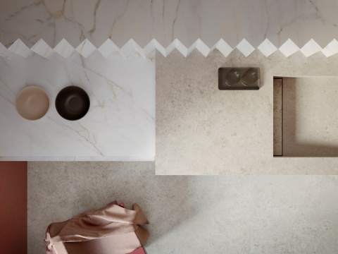 Blat Calacatta Supreme zestawiony z jasnym kamieniem, widok z góry na strefę kuchenną