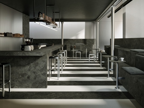 Nowoczesna kawiarnia z Marazzi Infinity Anthracite, ciemny kamień o głębokiej antracytowej strukturze