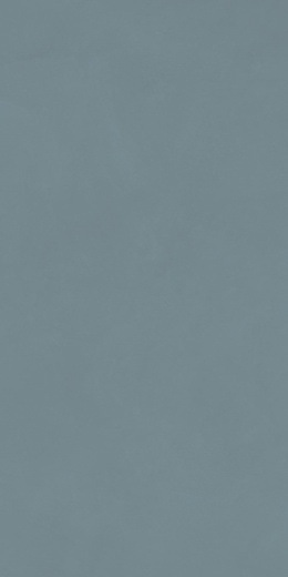 Marazzi Resin Look Azzurro z przygaszoną niebiesko-szarą bazą, delikatnymi przetarciami i subtelnymi przejściami tonalnymi