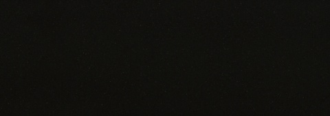 Pełna powierzchnia TechniStone Taurus Terazzo Dark w ciemnej kolorystyce.