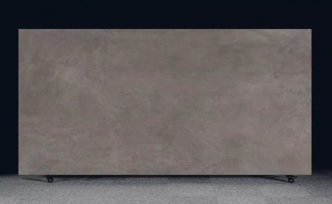 Płyta FLORIM Stone Cement Dark Grey Matte Soft o ciemnoszarej, betonowej powierzchni.