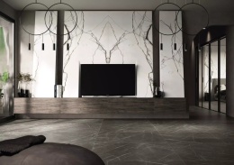 Nowoczesny salon z FLORIM Stone Marble Gray na podłodze, grafitowa powierzchnia z jasnym użyleniem.