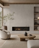 Nowoczesny salon z kominkiem i ścianą wykończoną spiekiem Florim Stone Sand Grey w stonowanych barwach.