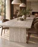 Elegancki stół z blatem z Travertine Nut 20 mm Matte Silk w jasnej jadalni.