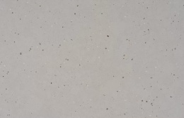 Silestone Concrete Pulse przedstawiająca jasnoszarą kolorystykę z dekoracyjnymi ziarnami