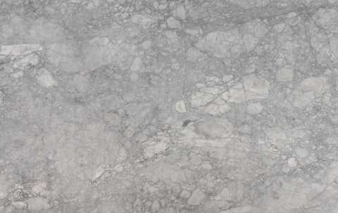Super Grey 20 mm Poler – szary kamień naturalny z nieregularnym, jasnym rysunkiem mineralnym.