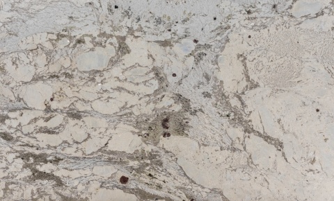 Antoinette 20 mm Natural – jasny granit o kremowo-szarym tle i nieregularnym rysunku mineralnym.