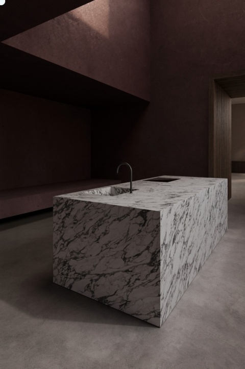 Neolith Calacatta Viola Natural Touch zastosowany na monolitycznej wyspie kuchennej z wyrazistym ciemnym użyleniem