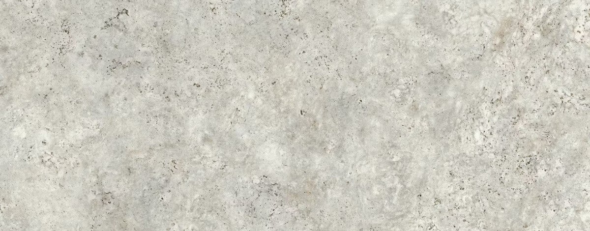 Zbliżenie na powierzchnię spieku kwarcowego Dekton Sabbia – jasnobeżowy odcień z naturalną, delikatnie żyłkowaną strukturą przypominającą wapienie