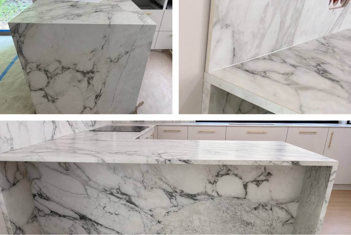 Detale realizacji Calacatta Extra Marazzi: blat, gniazdka i zabudowa wyspy